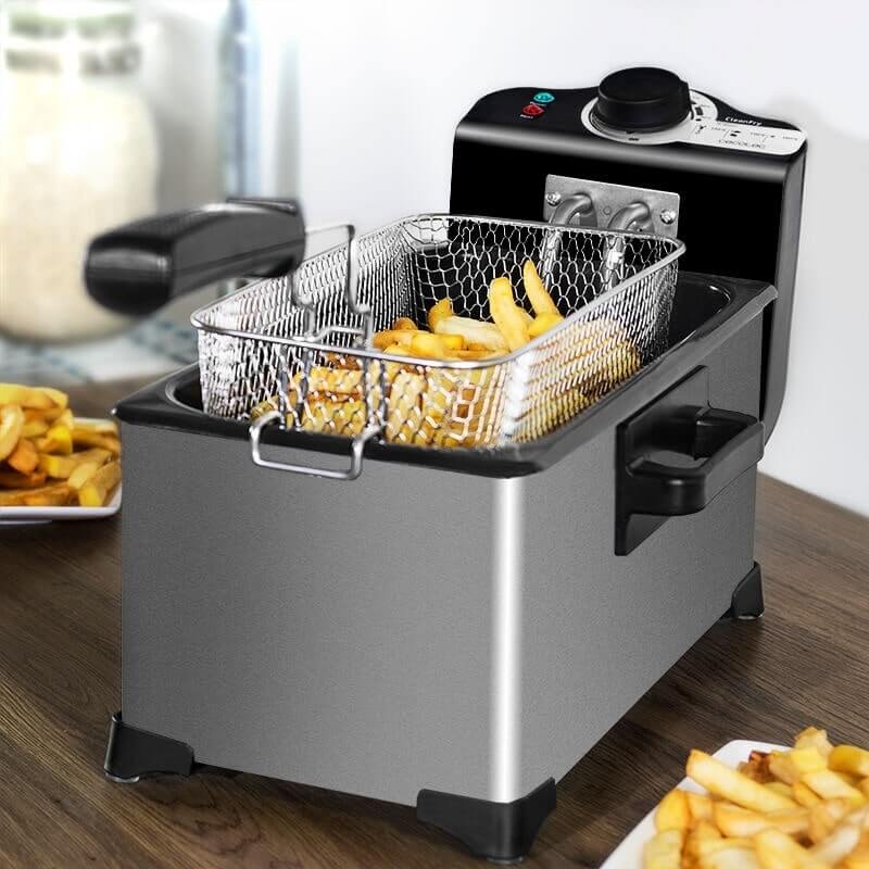 3L electric french fries fryer with cooking basket and crispy fries on a wooden table.